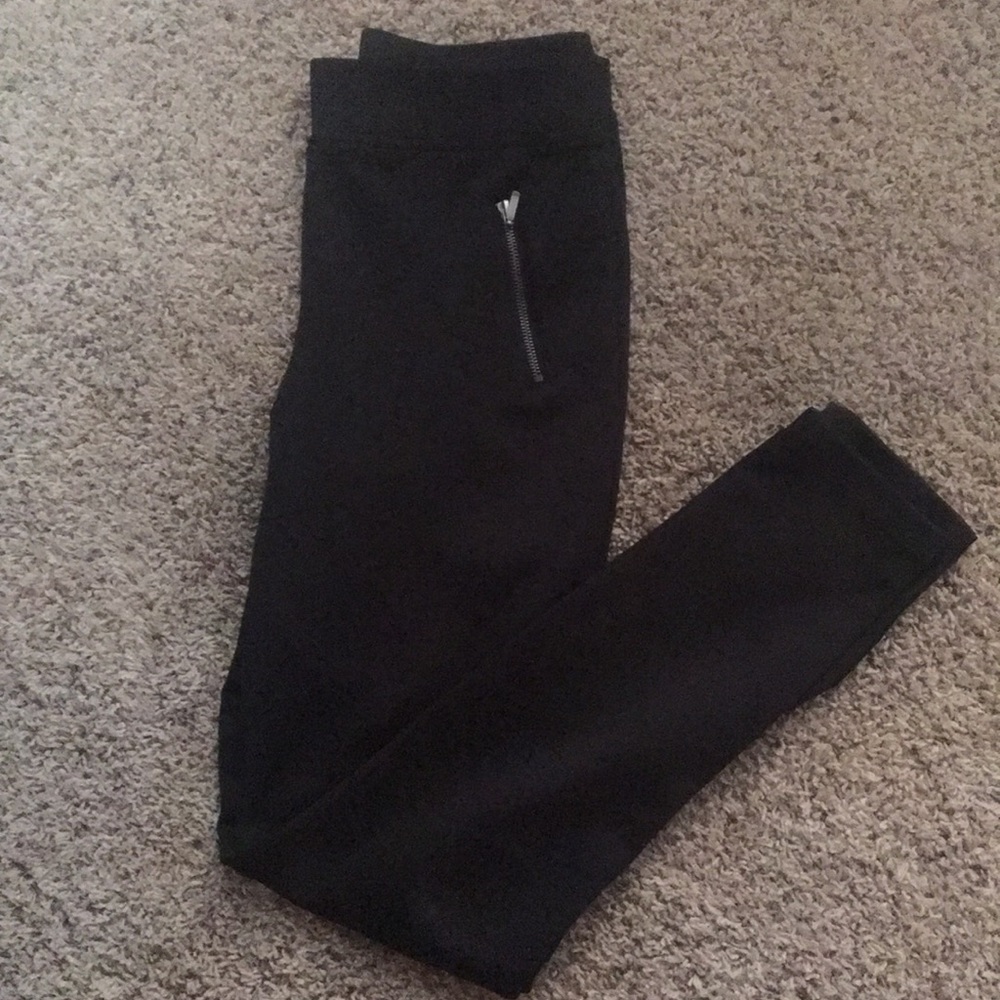 Black skinny ankle pants with zippers